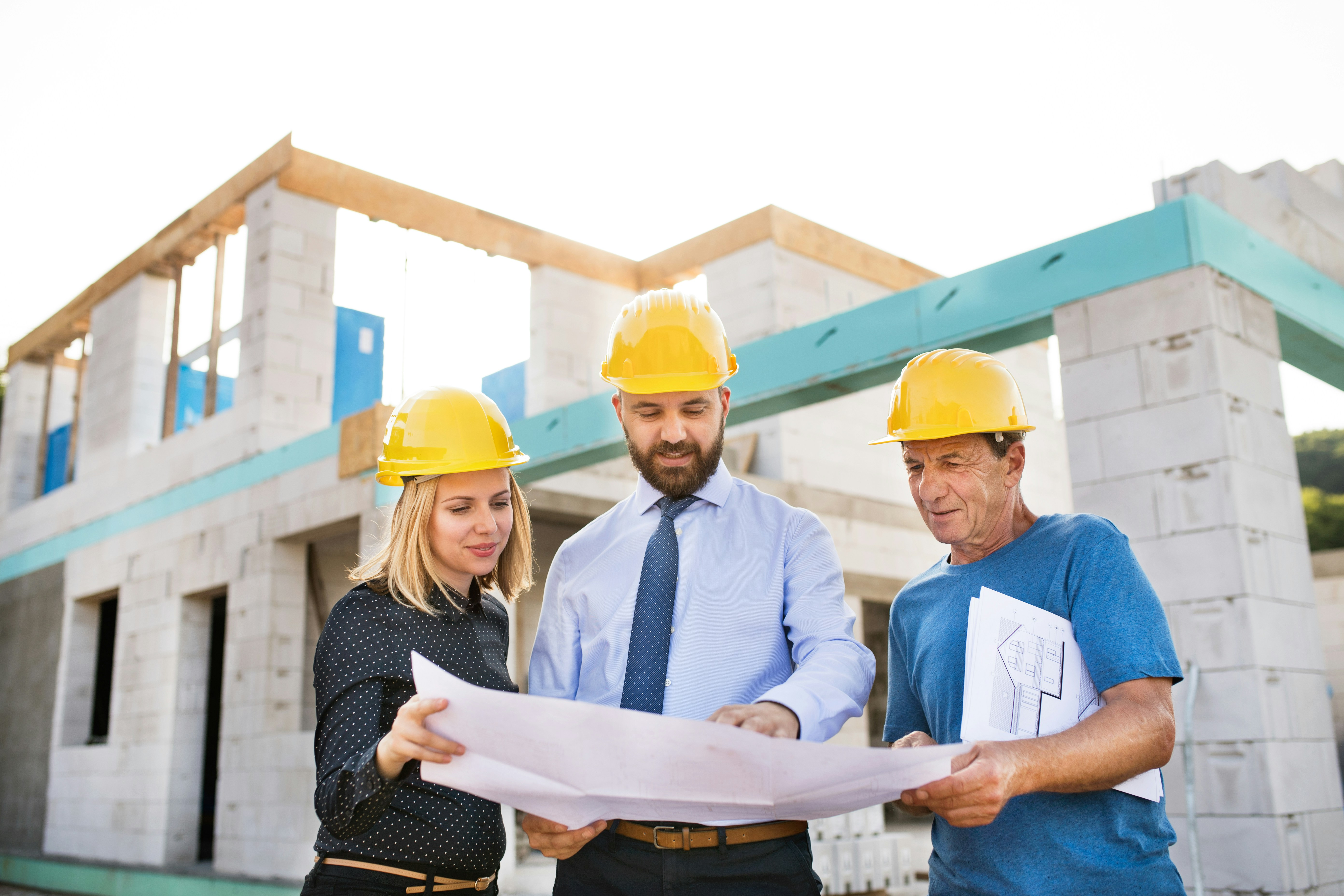 People reviewing blueprints
